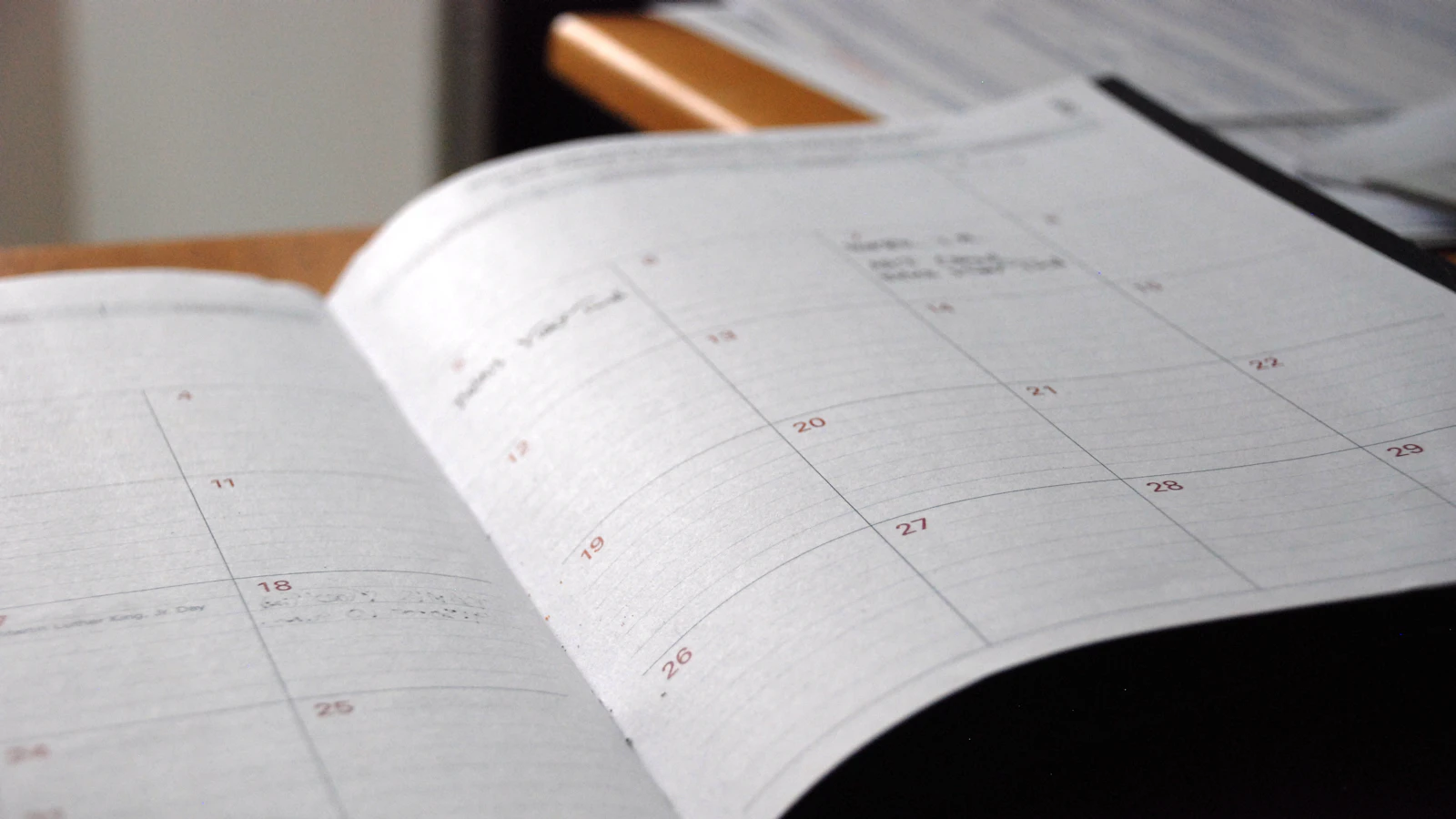 An open monthly planner on a desk